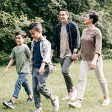 A family of four takes a walk together